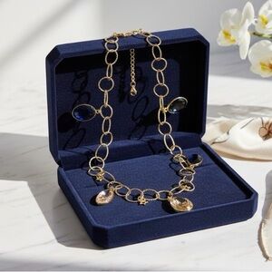 Elegant Gold Necklace with Blue and Black Accents